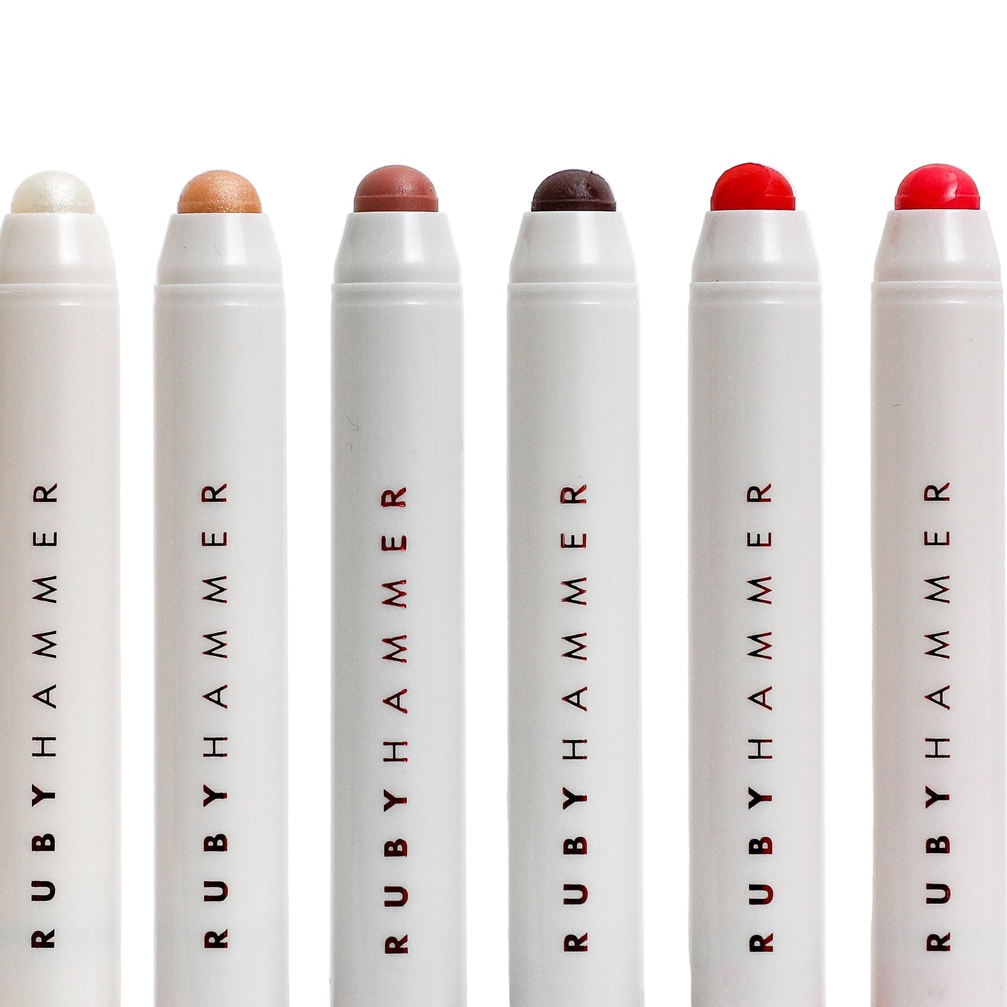 Set of Ruby Hammer makeup products on a white background