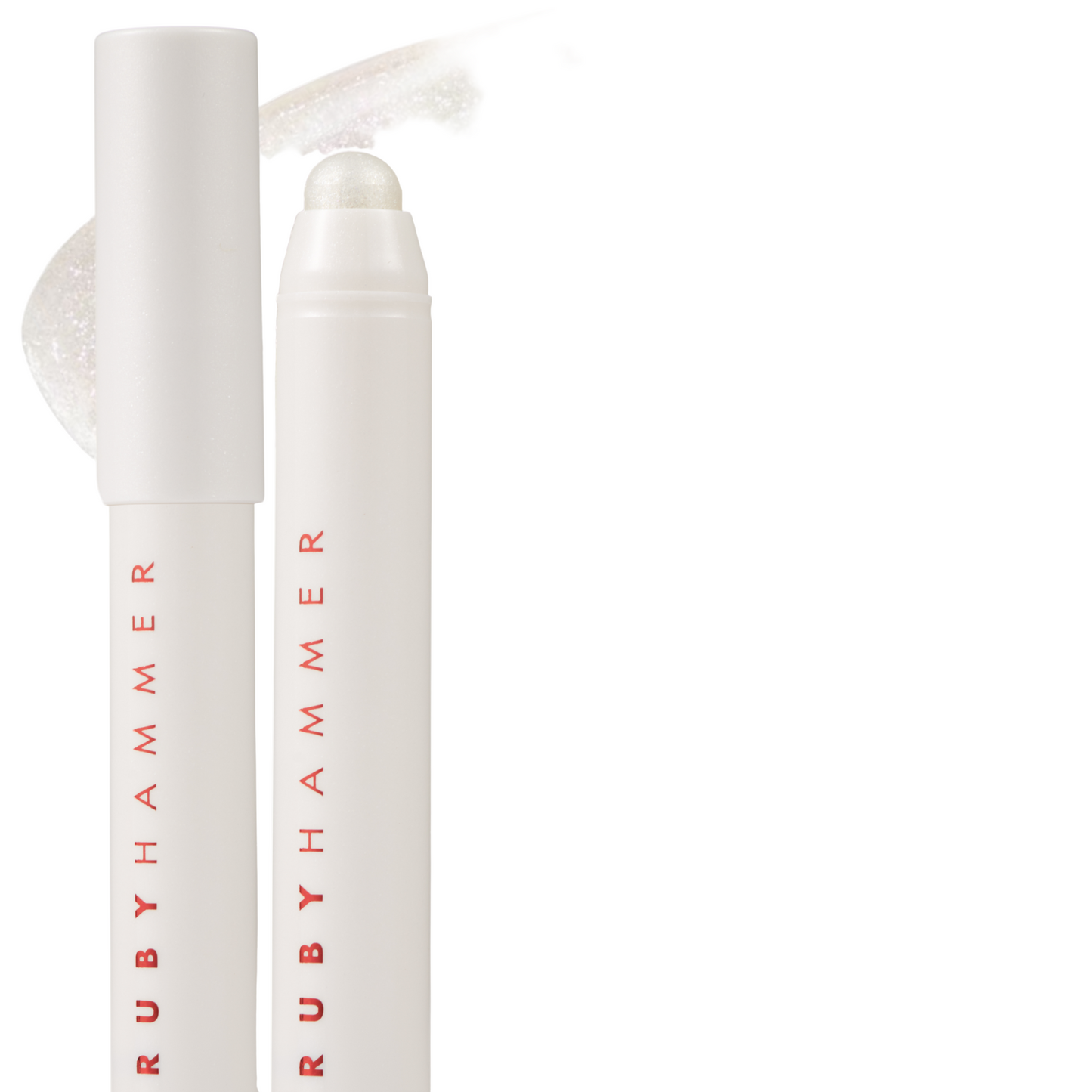Two white cosmetic pencils with 'Ruby Hammer' branding on a white background