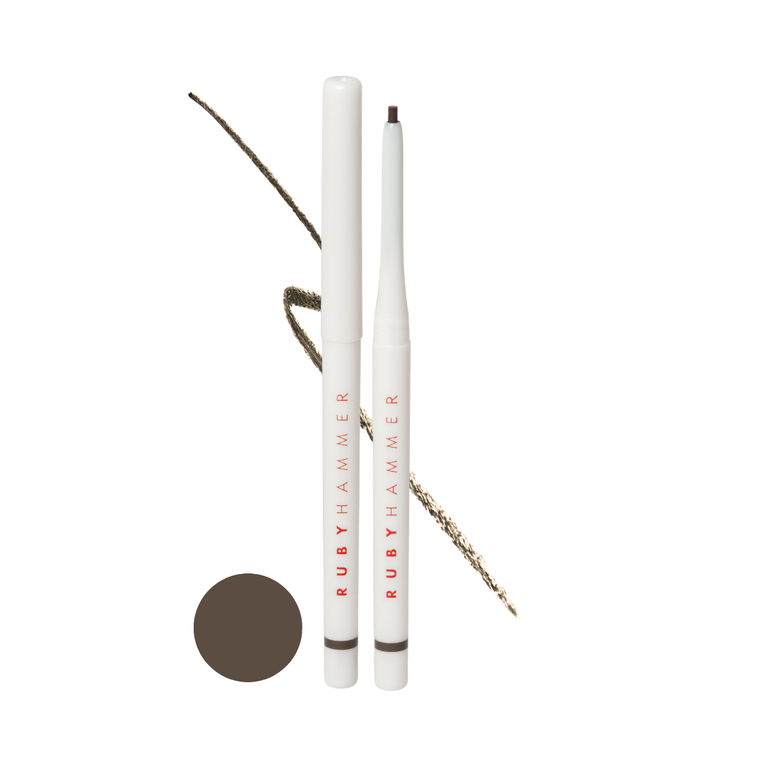Two white eye pencils with brown tips and 'Ruby Hammer' branding on a white background.