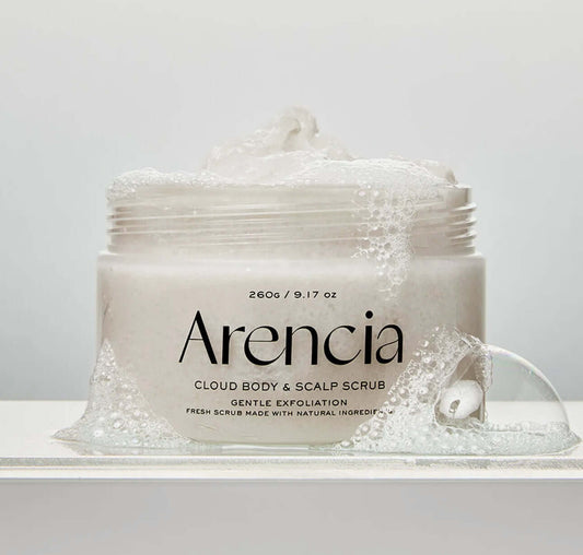 Arencia cloud body & scalp scrub jar with packaging on a light gray background