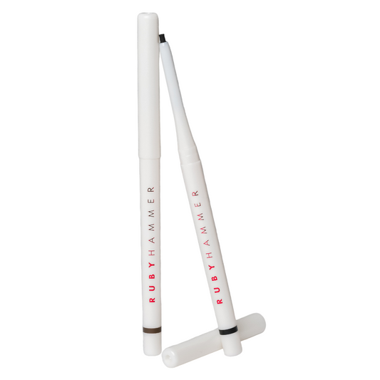 Two white Ruby Hammer drumsticks on a gray background