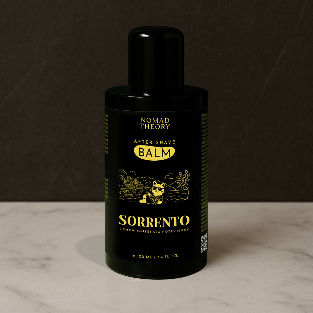 Black bottle of Nomad Theory Sorrento after shave balm on a marble surface with a dark background