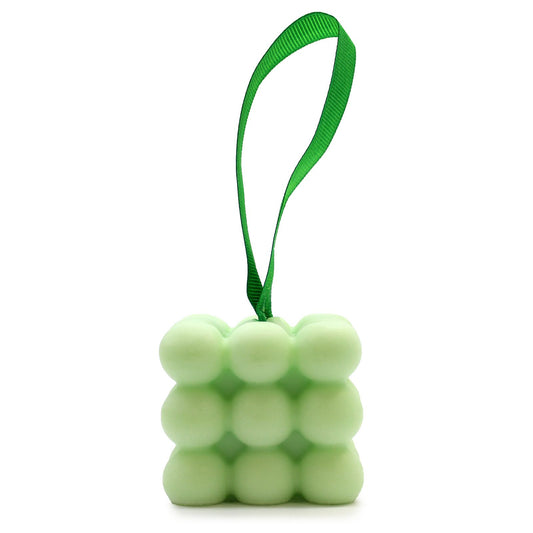 Green cube-shaped stress ball with a green strap on a white background