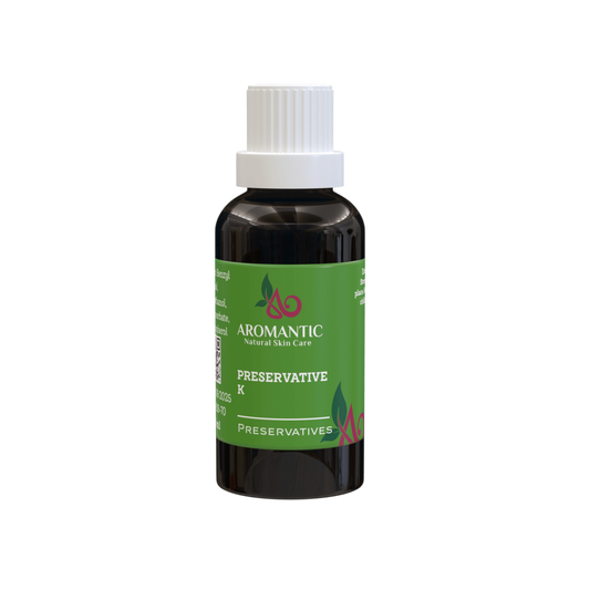 Bottle of Aromantic preservative on a green background